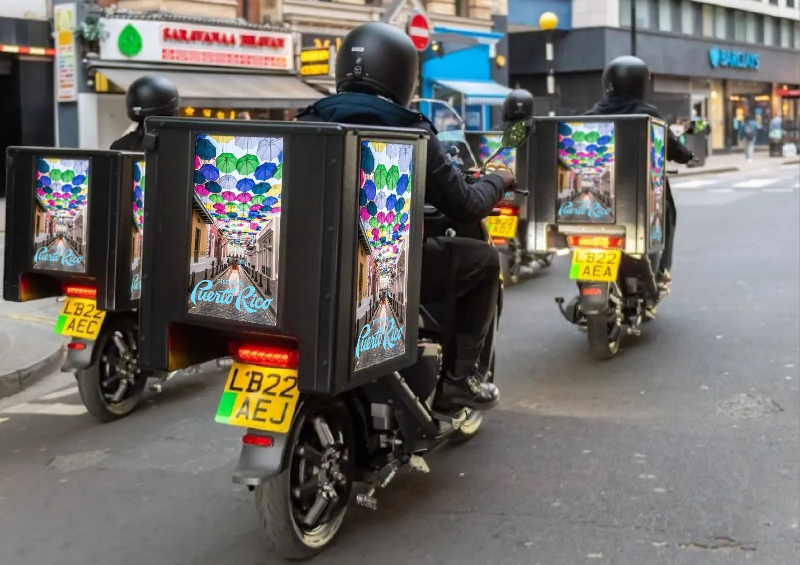 Ad|MOTO UK riders with Ad|BOX screens in London traffic